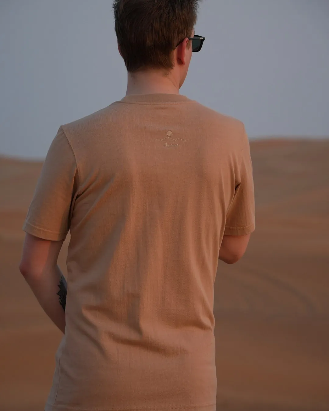 Empty Quarter — Regular, regular fit, worn in the dunes — the front, showing the set-in shoulder and the classic cut