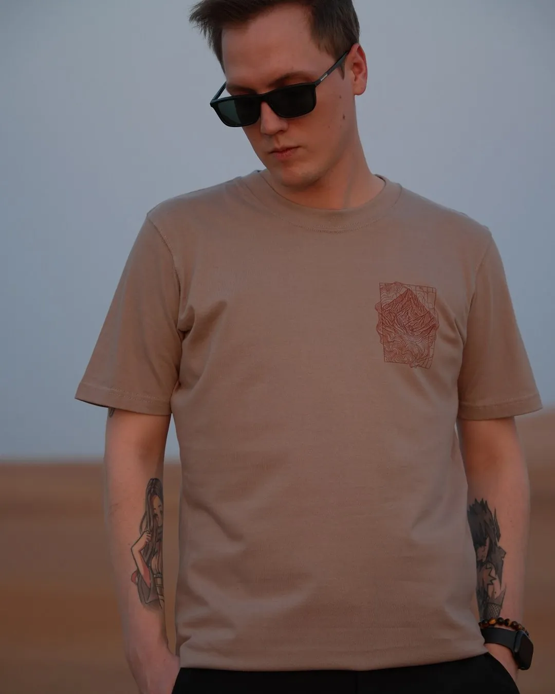 Hajar Mountains — Regular, regular fit, worn in the dunes — the front, showing the set-in shoulder and the classic cut